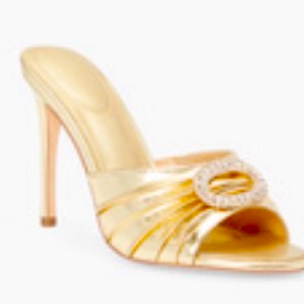 Gold heels with rhinestone buckle in front